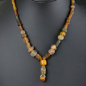 Necklace with Roman amber colour glass beads