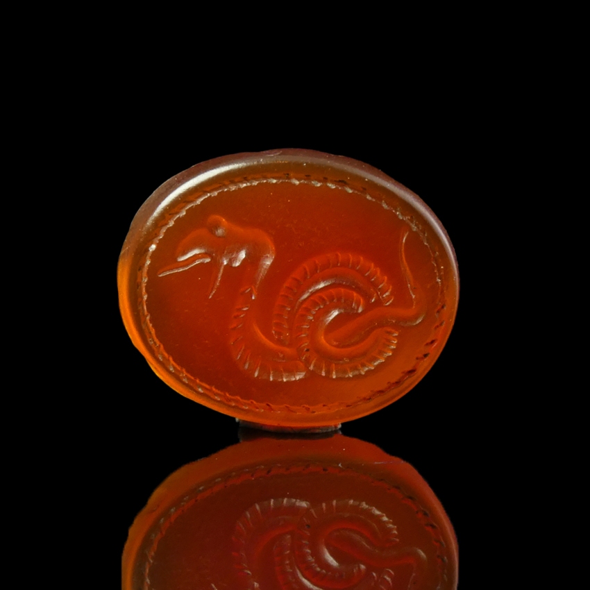 Ancient Greek carnelian intaglio with coiled snake