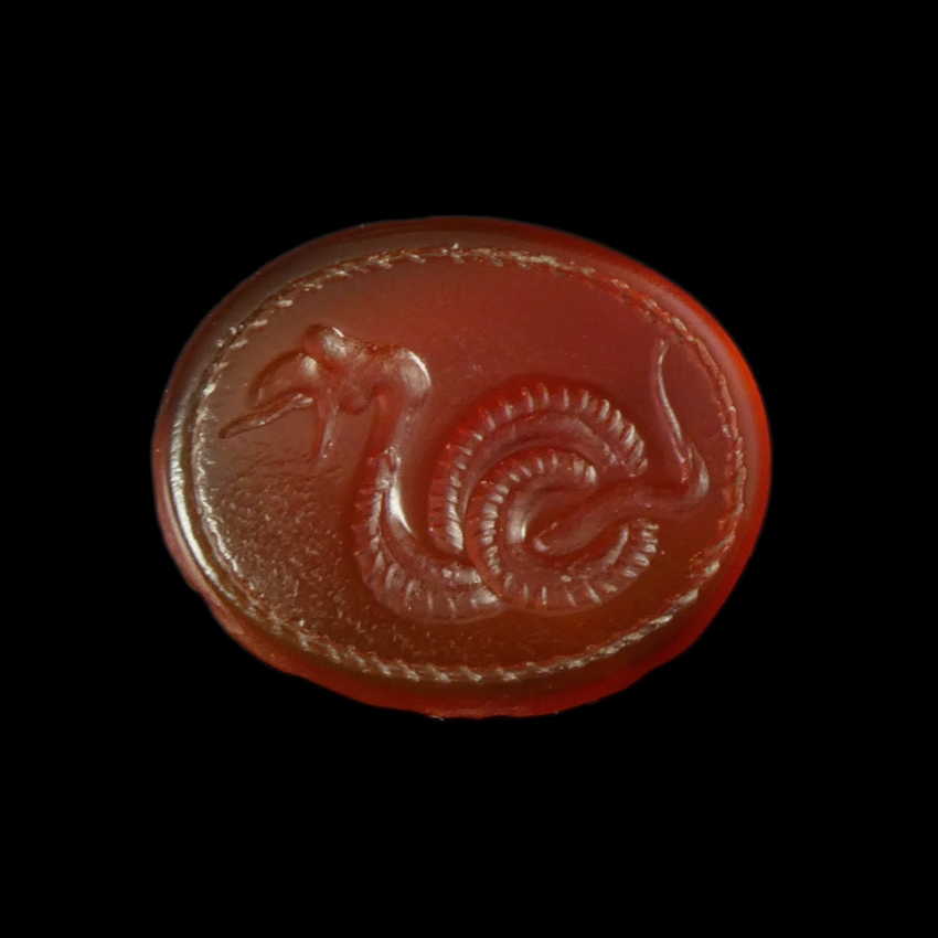 Ancient Greek carnelian intaglio with coiled snake