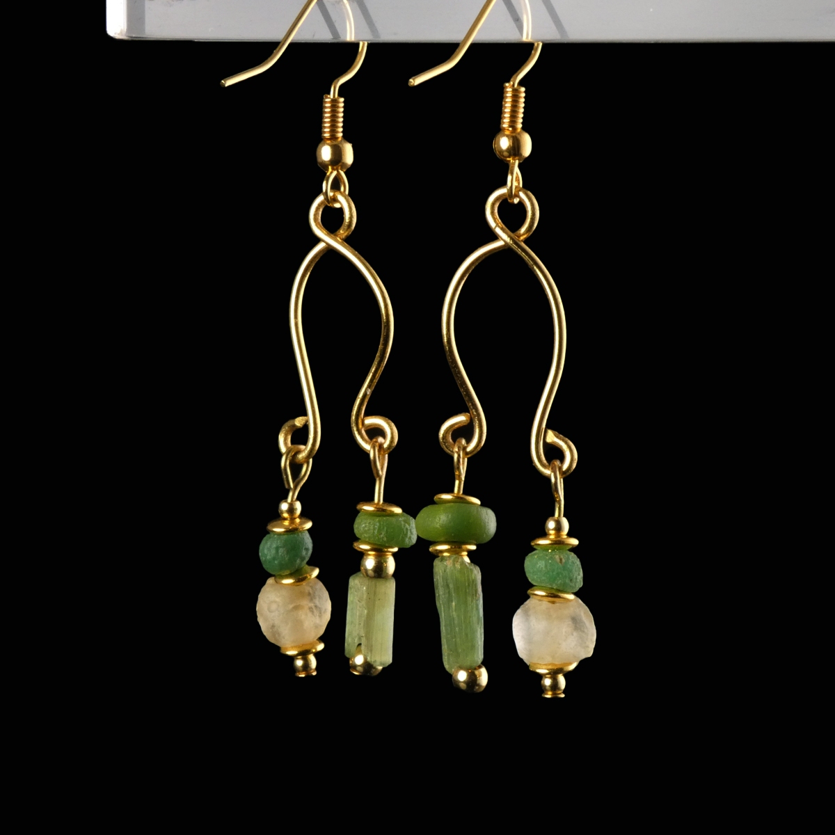 Earrings with Roman green and semi-translucent glass beads