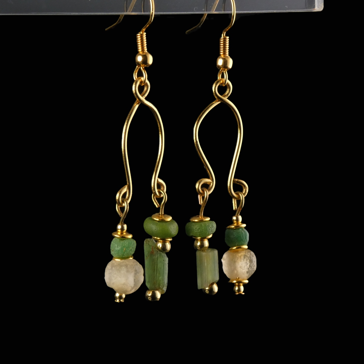 Earrings with Roman green and semi-translucent glass beads