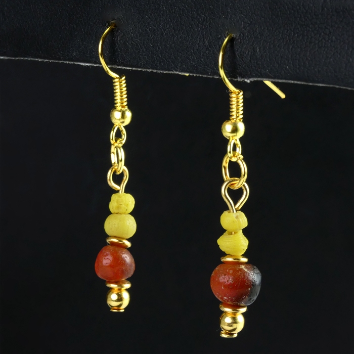 Earrings with yellow Roman glass and carnelian beads