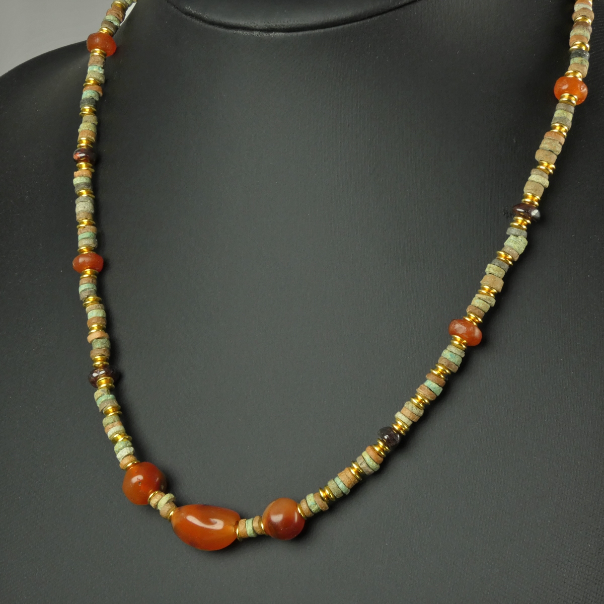 Necklace with Egyptian faience, carnelian and garnet beads