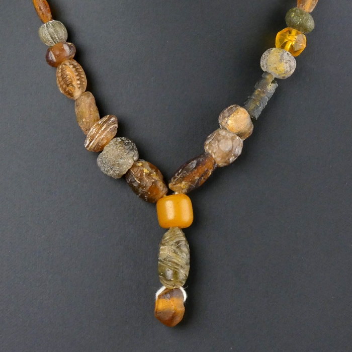 Necklace with Roman amber colour glass beads