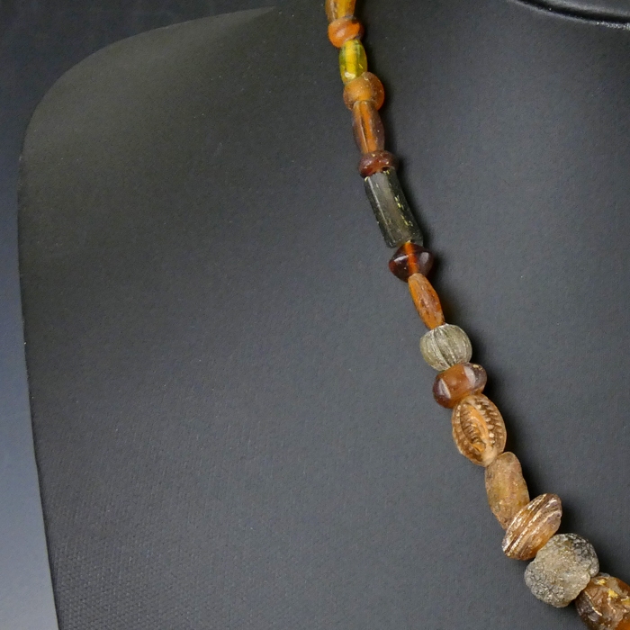 Necklace with Roman amber colour glass beads