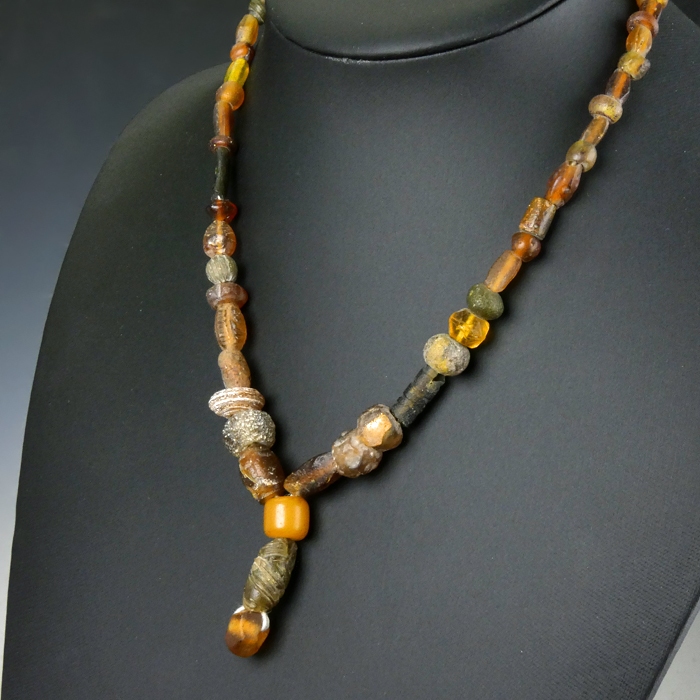 Necklace with Roman amber colour glass beads