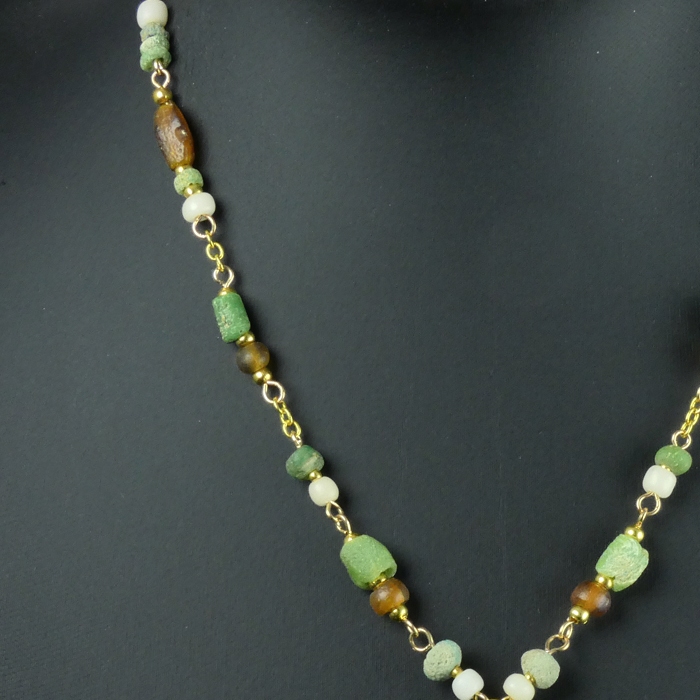 Necklace with Roman green, white and amber glass beads