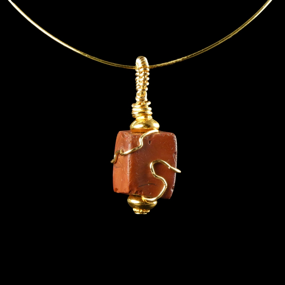 Pendant with a wire-wrapped Roman red glass bead