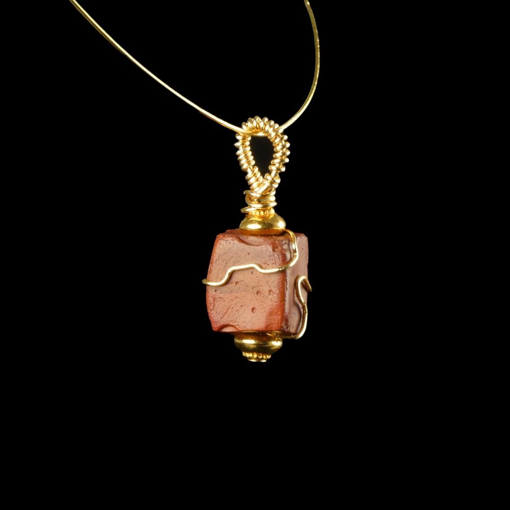 Pendant with a wire-wrapped Roman red glass bead