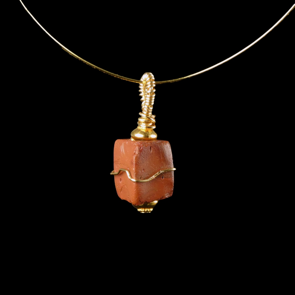 Pendant with a wire-wrapped Roman red glass bead