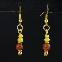 Earrings with yellow Roman glass and carnelian beads