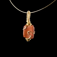 Pendant with a wire-wrapped Roman red glass bead