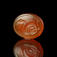 Ancient Greek carnelian intaglio with coiled snake
